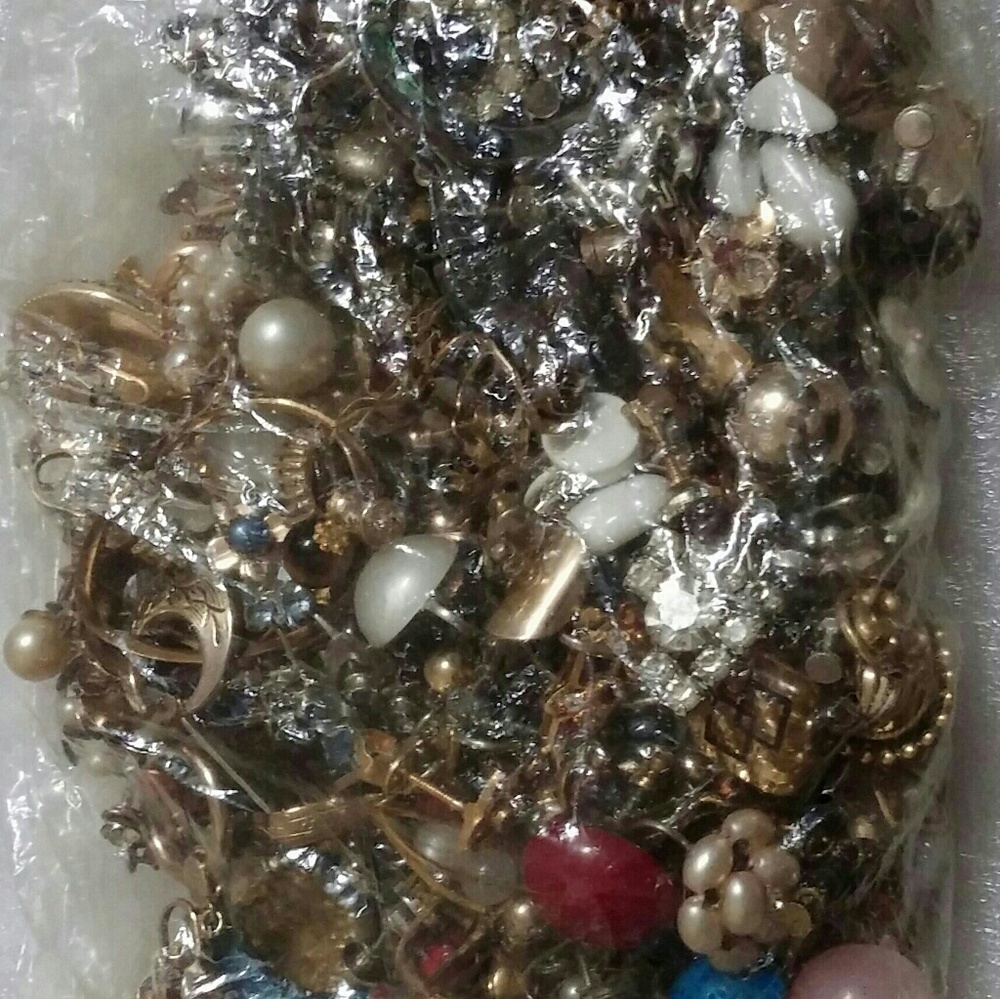 Over 100 Mismatch screw back earrings